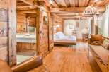 Discover the charm of this stunning property, featuring exquisite wooden interiors and a cozy ambiance.