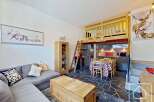 Discover this charming property featuring a cozy living area with a comfortable sofa and decorative pillows.