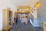 Discover this charming property featuring a cozy loft area, perfect for a unique living experience.