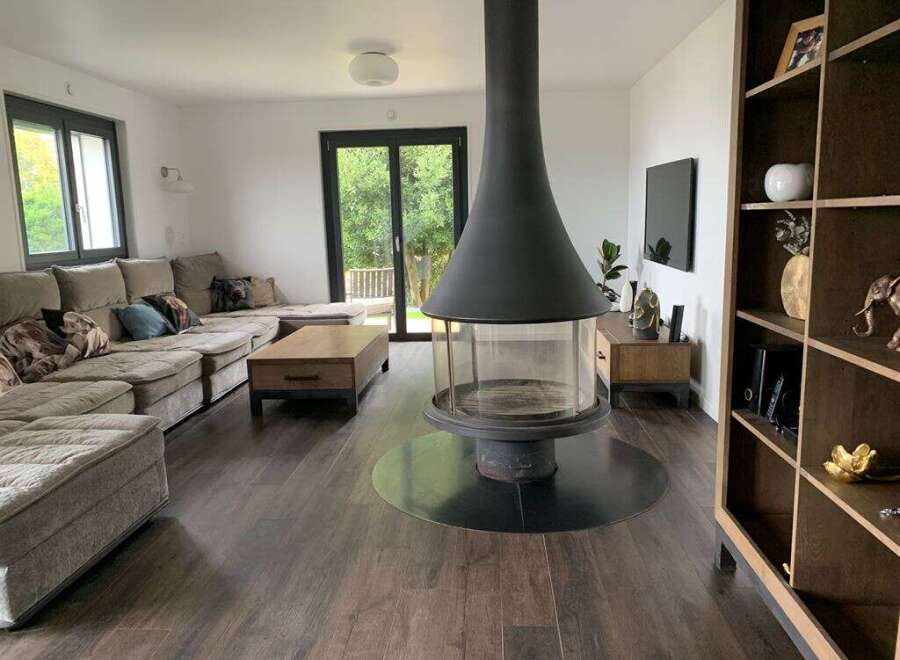 This stunning living room boasts a modern fireplace, creating a cozy ambiance.