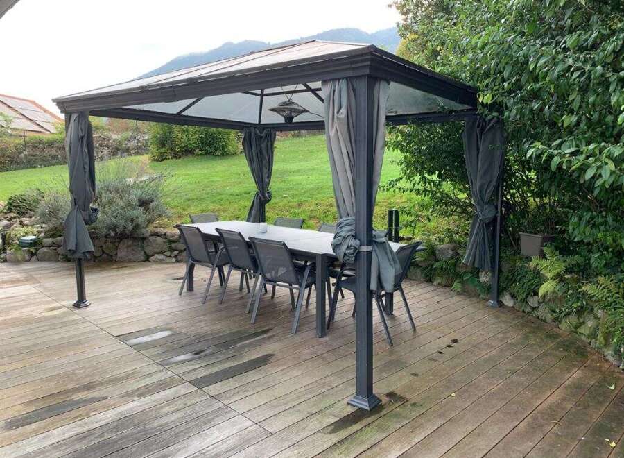 Enjoy outdoor living at its finest with this stunning property featuring a stylish gazebo.