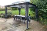 Enjoy outdoor living at its finest with this stunning property featuring a stylish gazebo.