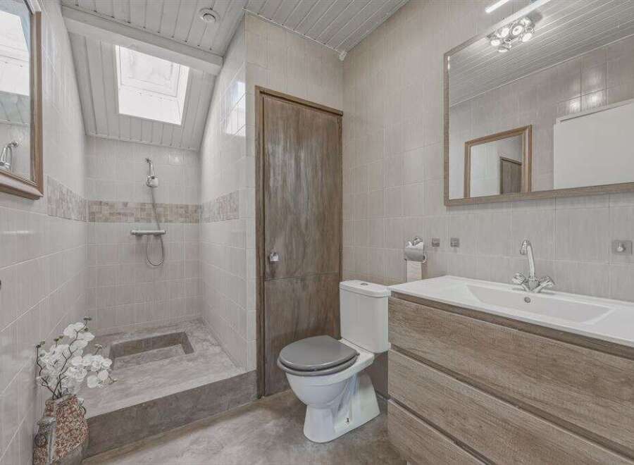 Step into this inviting bathroom featuring a walk-in shower, perfect for a refreshing start to your day.