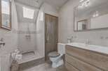 Step into this inviting bathroom featuring a walk-in shower, perfect for a refreshing start to your day.