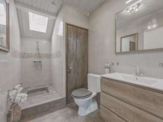 Step into this inviting bathroom featuring a walk-in shower, perfect for a refreshing start to your day.