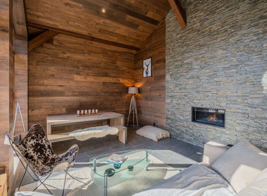 Experience the warmth of this stunning living space, featuring a cozy fireplace and inviting ambiance.