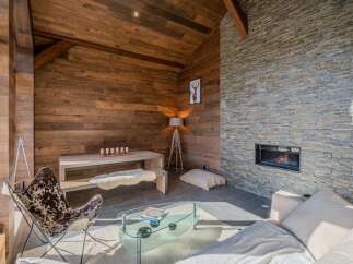 Experience the warmth of this stunning living space, featuring a cozy fireplace and inviting ambiance.