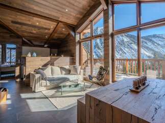 Experience luxury living in this stunning mountain chalet, boasting breathtaking views of snow-capped peaks.