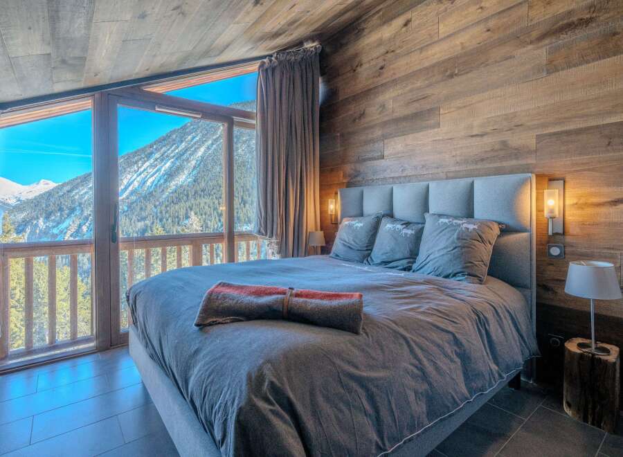 Experience the ultimate mountain retreat in this stunning bedroom.
