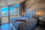 Experience the ultimate mountain retreat in this stunning bedroom.
