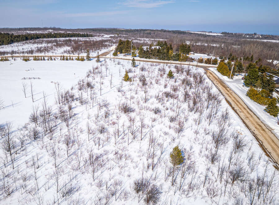 This aerial view showcases a serene winter landscape, perfect for those seeking a tranquil retreat.