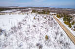 This aerial view showcases a serene winter landscape, perfect for those seeking a tranquil retreat.