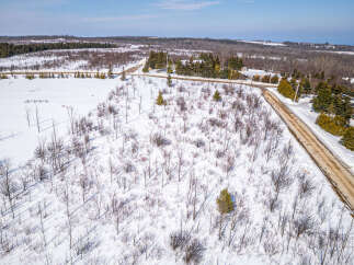 This aerial view showcases a serene winter landscape, perfect for those seeking a tranquil retreat.