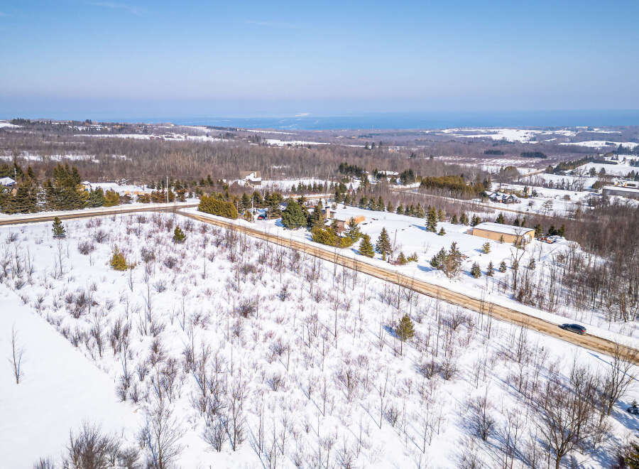 Discover a stunning property nestled in a serene winter landscape.