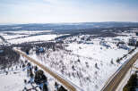 This stunning property offers a serene winter landscape, perfect for those seeking a peaceful retreat.