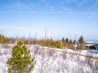 Discover the tranquility of this stunning property, nestled in a serene winter landscape.
