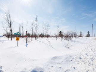 This stunning property offers a serene winter landscape, perfect for those seeking tranquility.