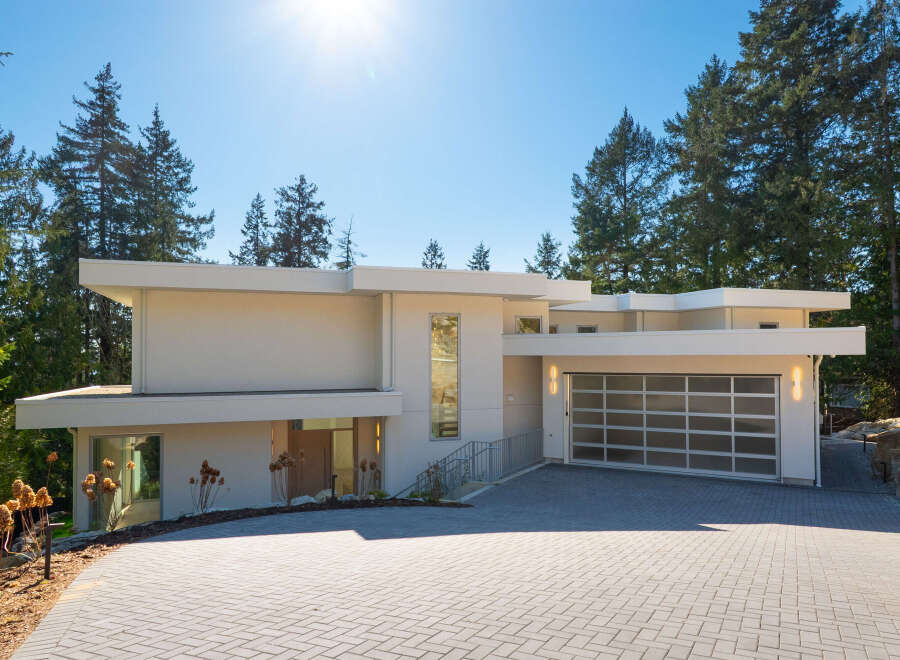 This stunning modern home boasts a sleek design and a prime location.
