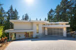This stunning modern home boasts a sleek design and a prime location.