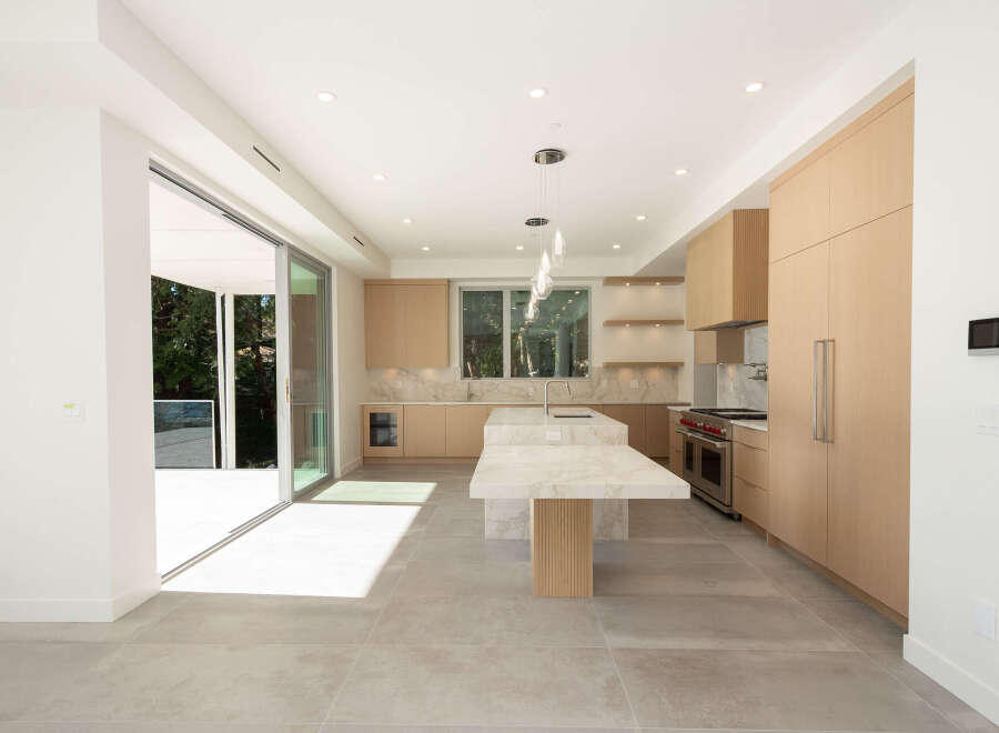 Step into modern luxury with this stunning kitchen.