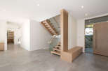 Step into modern elegance with this stunning home featuring a floating staircase and sleek glass railings.