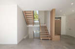 This stunning property boasts a modern staircase design, creating a focal point in the entryway.