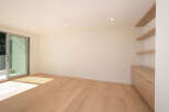 Step into this bright and airy modern living space, featuring beautiful hardwood floors and ample natural light.