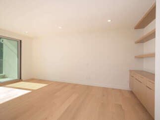 Step into this bright and airy modern living space, featuring beautiful hardwood floors and ample natural light.