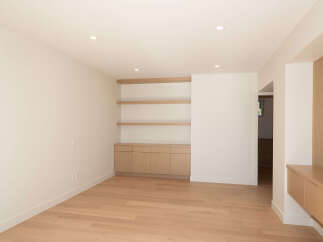 This stunning property boasts a modern interior with sleek lines and a neutral color palette.