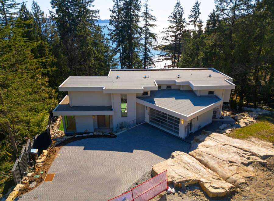 This stunning modern home offers a luxurious living experience with its sleek design and prime location.