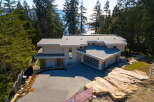 This stunning modern home offers a luxurious living experience with its sleek design and prime location.