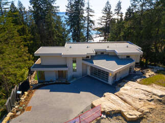 This stunning modern home offers a luxurious living experience with its sleek design and prime location.