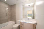 Step into this modern bathroom, featuring a sleek design and high-end finishes.