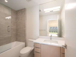 Step into this modern bathroom, featuring a sleek design and high-end finishes.