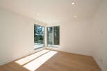 This stunning property boasts a modern interior with an abundance of natural light, perfect for creating a warm and inviting atmosphere.