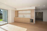 This stunning property boasts a modern wet bar, perfect for entertaining guests.