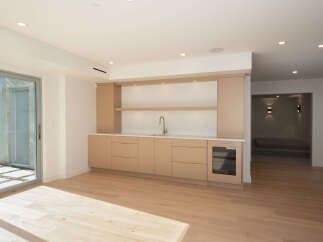 This stunning property boasts a modern wet bar, perfect for entertaining guests.