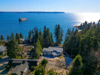 This stunning property boasts a modern architectural design with a sleek, contemporary aesthetic.
