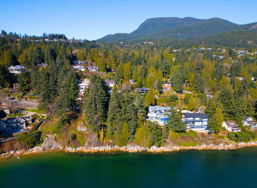Luxury waterfront homes nestled along the scenic coastline offer breathtaking views and unparalleled privacy.