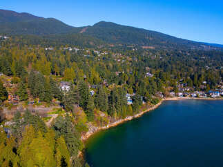 Discover a stunning coastal property nestled amidst lush greenery and breathtaking ocean views.