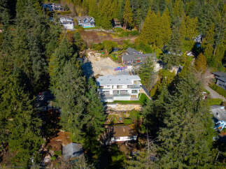 This stunning property offers a unique blend of modern design and natural beauty.