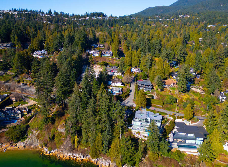 Discover luxury living nestled amidst lush greenery and stunning ocean views.