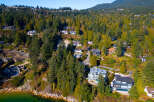 Discover luxury living nestled amidst lush greenery and stunning ocean views.