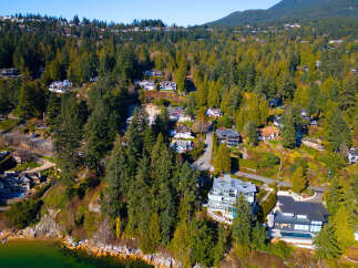 Discover luxury living nestled amidst lush greenery and stunning ocean views.