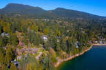 Discover the epitome of coastal living with this stunning property nestled amidst lush greenery.