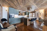 This stunning kitchen boasts a rustic yet modern design, perfect for a cozy mountain retreat.