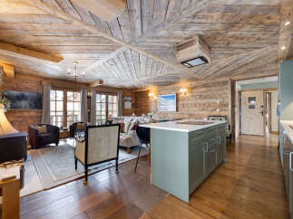 Experience the epitome of rustic luxury in this stunning property, featuring exquisite wooden accents throughout.