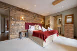 Experience rustic elegance in this stunning bedroom.