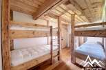 This charming property features rustic bunk beds, perfect for accommodating guests or family.