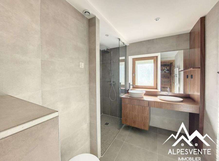 Discover a modern bathroom design with a sleek shower and elegant vanity.
